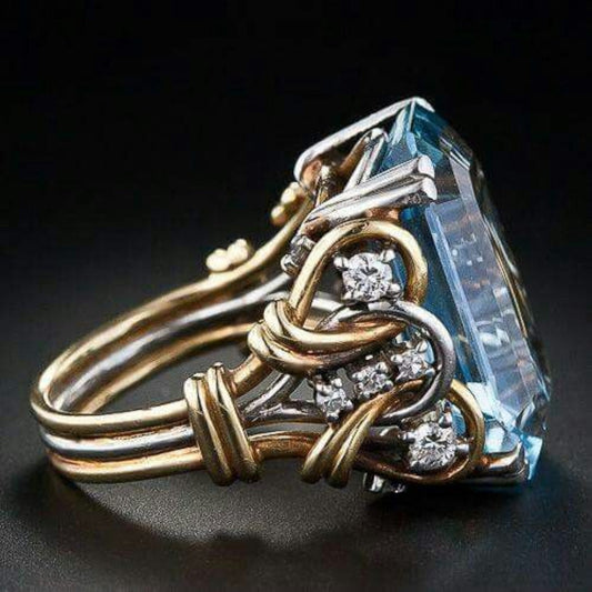 Anillo de oro con capas y zirconia azul vintage