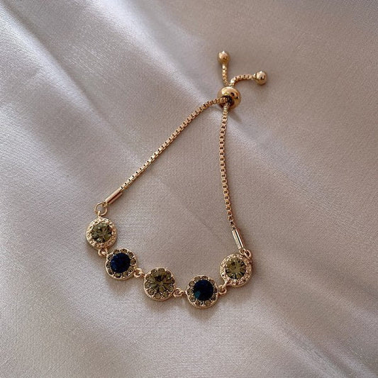 Pulsera de cristales verdes en oro