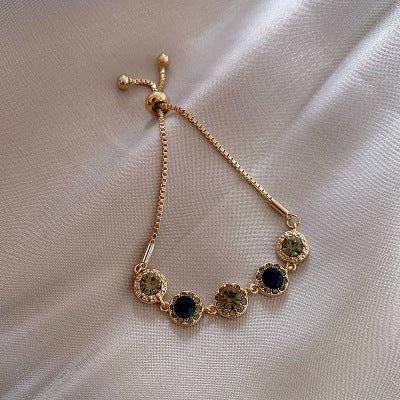 Pulsera de cristales verdes en oro